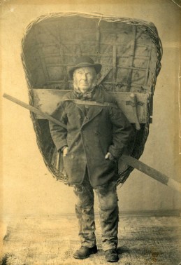 Fisherman carrying a coracle