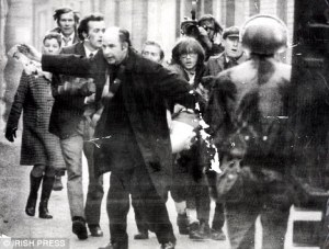 Bishop Daly helping victims of Bloody Sunday. Daily Mail
