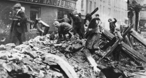 Children prospecting in rubble